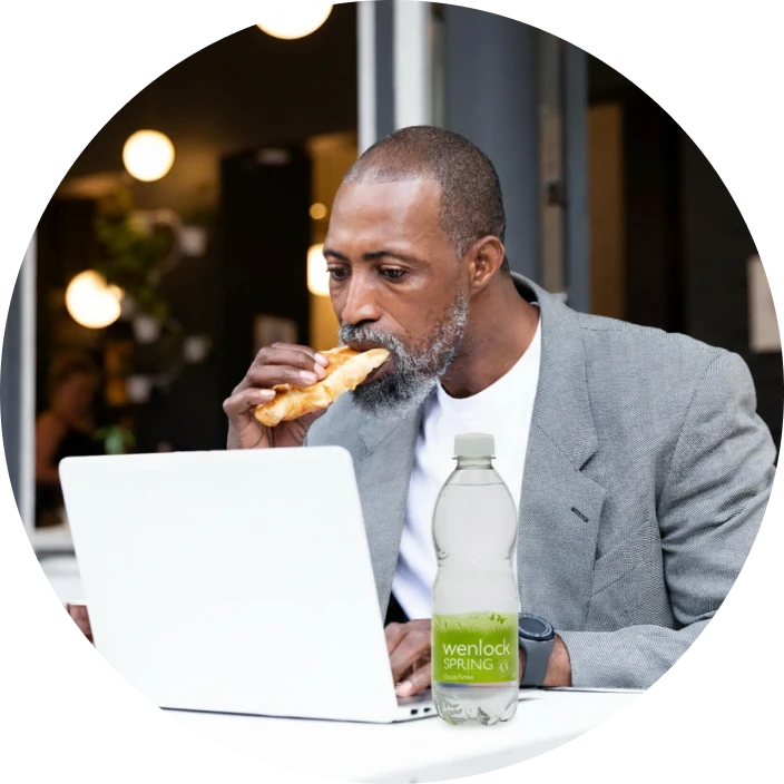 water on the go man having a working lunch