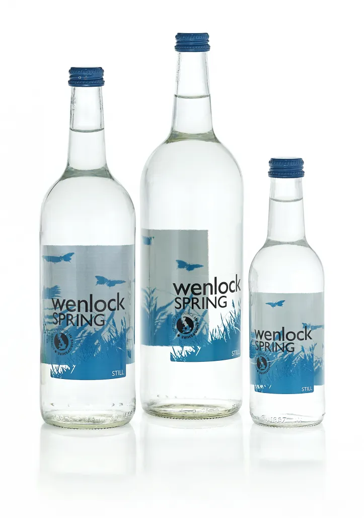 still natural spring water in glass bottles